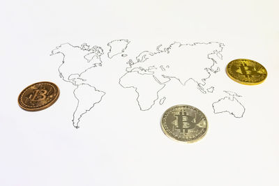 Close-up of coins on white background