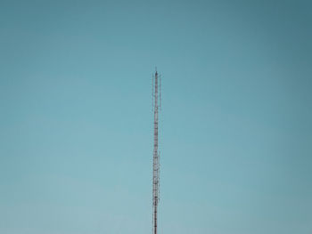 Low angle view of vapor trail against clear blue sky