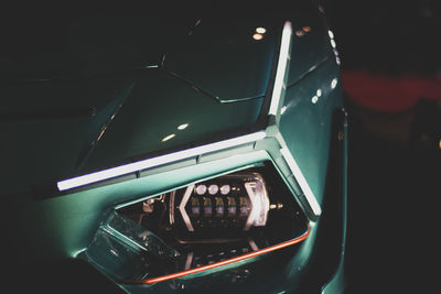 Close-up of illuminated airplane in car