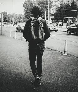 Rear view of man walking on street