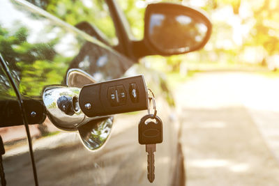 Close-up of key on car door