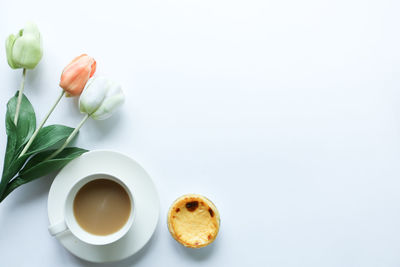 High angle view of cake on table against white background