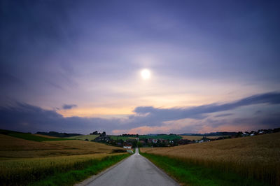 Road passing through field