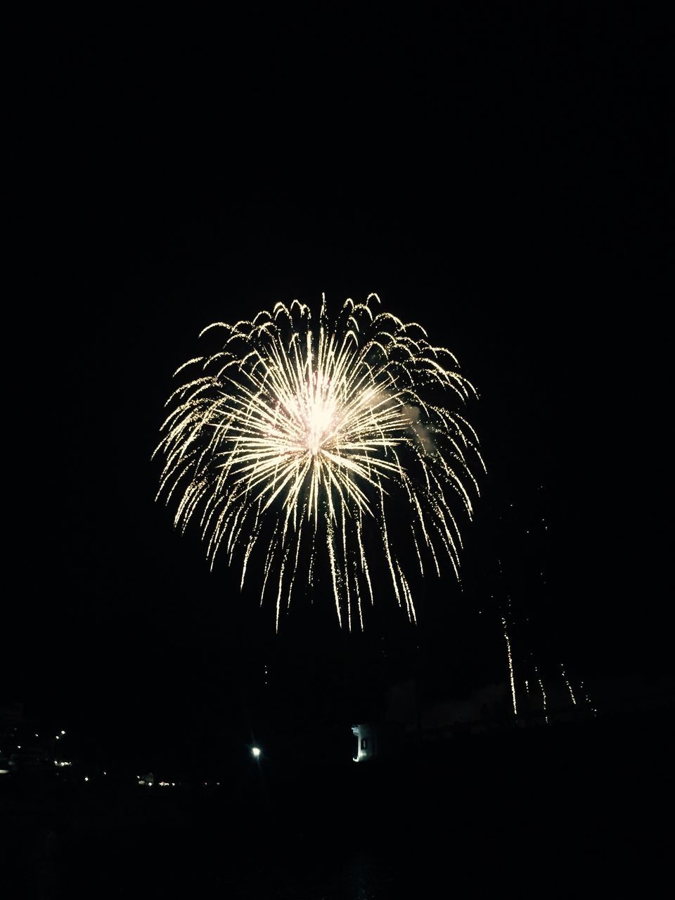 night, firework display, illuminated, exploding, long exposure, firework - man made object, glowing, celebration, motion, arts culture and entertainment, event, firework, sparks, low angle view, blurred motion, entertainment, sky, fire - natural phenomenon, dark, clear sky