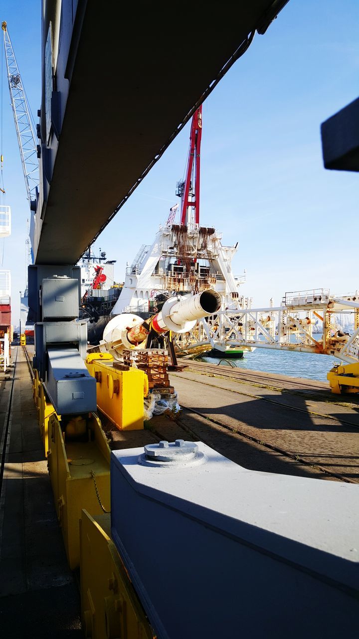 transportation, mode of transport, built structure, architecture, clear sky, building exterior, nautical vessel, moored, harbor, boat, freight transportation, sky, crane - construction machinery, outdoors, snow, no people, winter, commercial dock, city, day