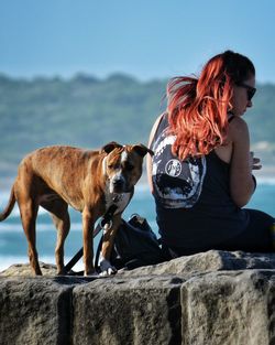 Full length of woman standing on footpath