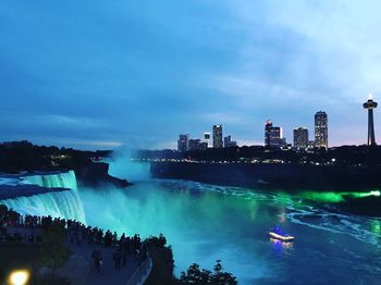 Niagara falls illuminated against sky