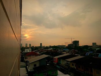 Cityscape against sky during sunset