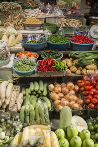 High angle view of various vegetables arranged at market stall for sale