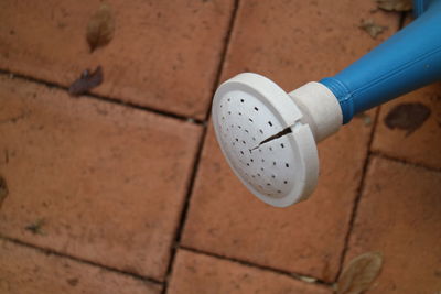 High angle view of coin on floor