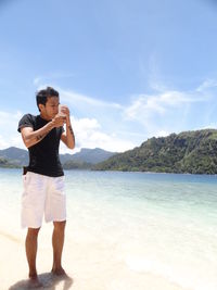 Man smoking at beach