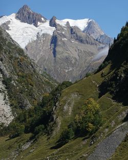 Scenic view of snowcapped mountains against sky