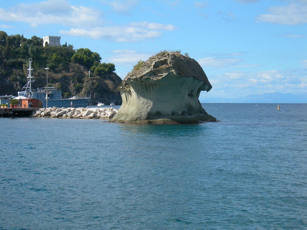 sea, water, sky, waterfront, horizon over water, tranquil scene, tranquility, scenics, beauty in nature, nature, rock formation, rock - object, blue, rippled, cloud, idyllic, cloud - sky, day, nautical vessel, outdoors