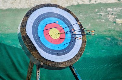 Arrows on sports target against net