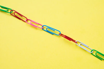 High angle view of bicycle on table against yellow background