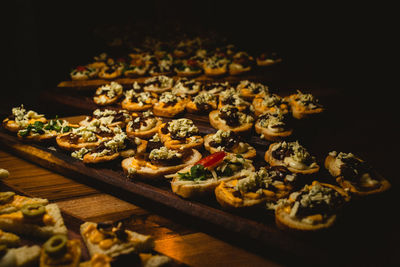 Close-up of food on table against black background