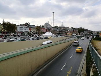 Cars on road against sky
