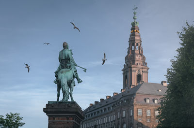 Low angle view of statue against sky