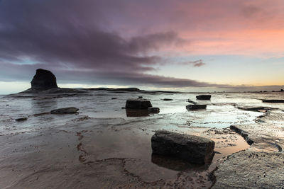 Scenic view of sea against sky at sunset