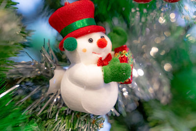 Close-up of christmas decoration on tree during winter