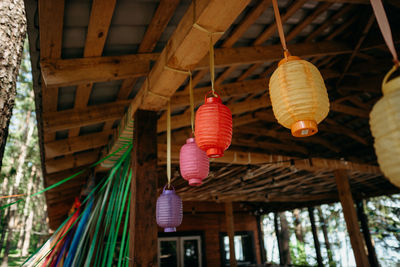 Low angle view of lanterns hanging on ceiling of building