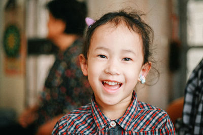 Close-up of cute girl at home