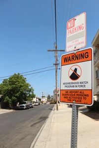 Road sign against clear sky