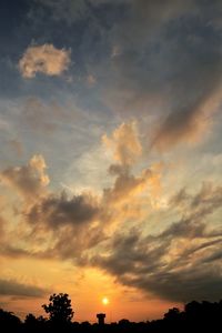 Low angle view of silhouette trees against sky at sunset