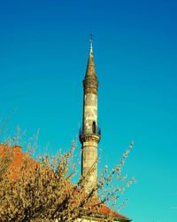 Low angle view of built structure against clear blue sky