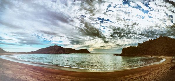 Scenic view of beach against sky