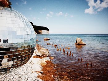 Dome at beach against sky