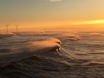 Scenic view of seascape against sky during sunset