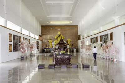 People walking in corridor of building