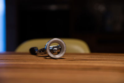 Close-up of camera on table