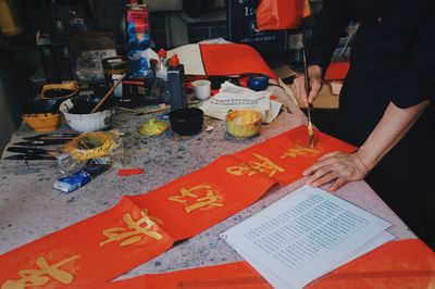 High angle view of man painting on table