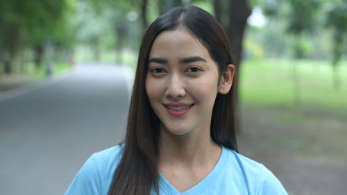 Portrait of smiling young woman outdoors