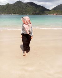 Woman walking at beach