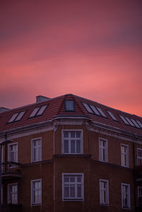 Low angle view of building against sky during sunset