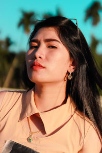 Portrait of beautiful young woman looking away