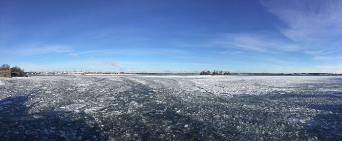 Scenic view of field against sky during winter