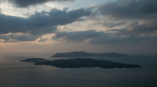 Scenic view of sea against storm clouds