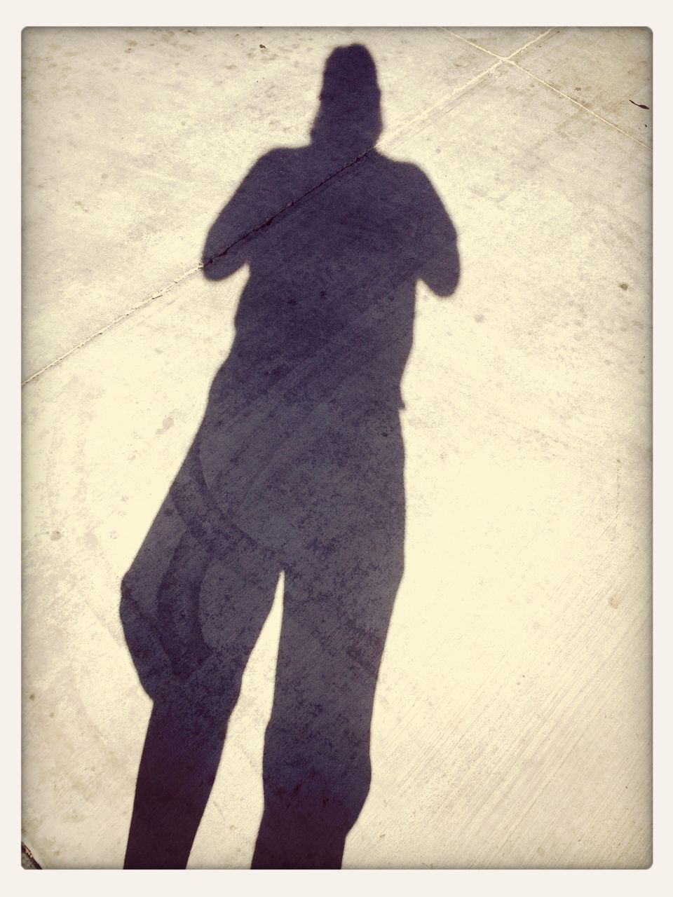 transfer print, shadow, focus on shadow, auto post production filter, lifestyles, sunlight, high angle view, leisure activity, silhouette, standing, men, full length, outdoors, day, street, outline, three quarter length, unrecognizable person