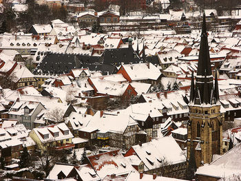 Snow covered rooftops and church building