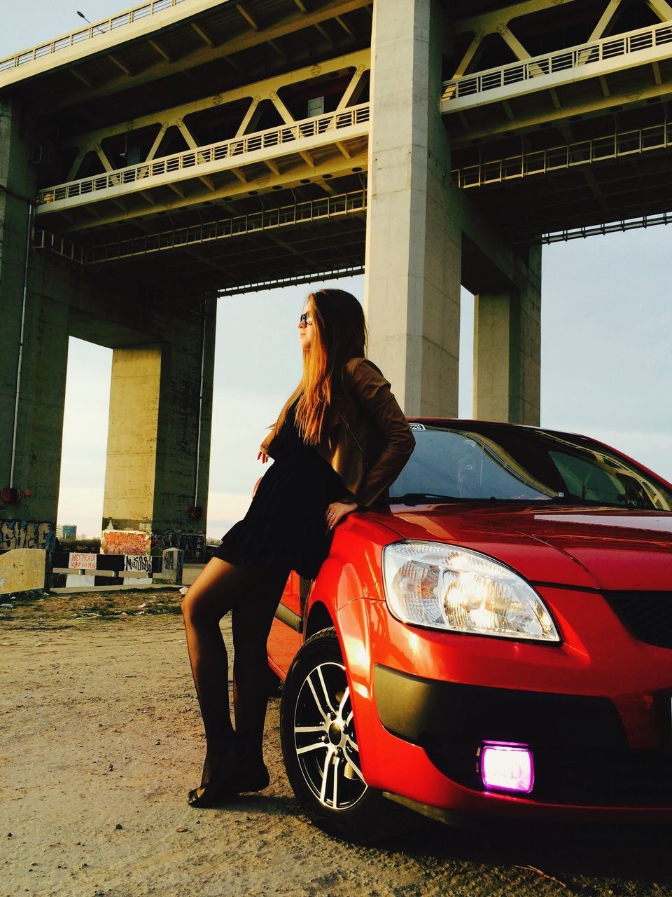 young adult, lifestyles, person, transportation, sitting, casual clothing, leisure activity, mode of transport, young women, full length, side view, land vehicle, car, standing, portrait, sunglasses, three quarter length