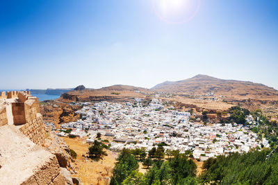 Townscape against clear blue sky