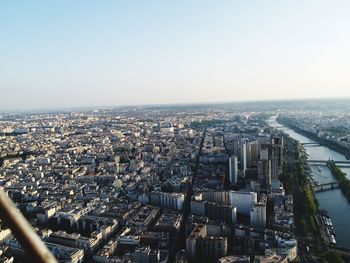 High angle view of illuminated city buildings against clear sky