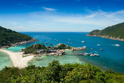 High angle view of sea and bay against sky