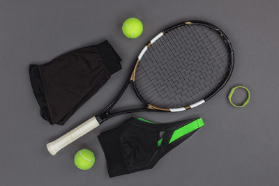 High angle view of tennis and racket on table