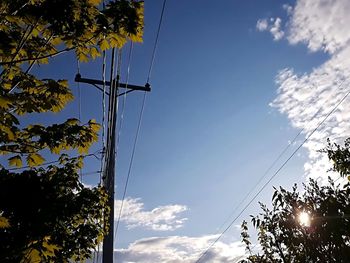 Low angle view of electricity pylon against sky