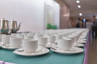Close-up of tea cups on table in restaurant